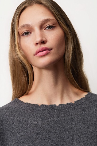 Wool sweater with distressed details
