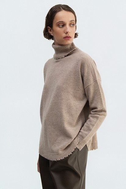 Wool turtleneck sweater with distressed details