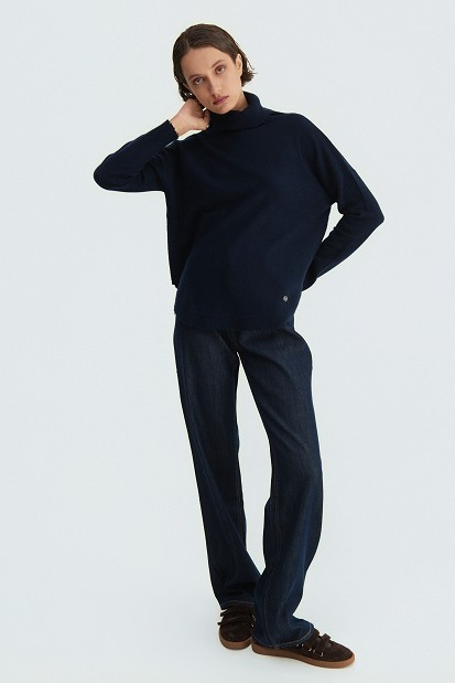Wool turtleneck sweater with distressed details