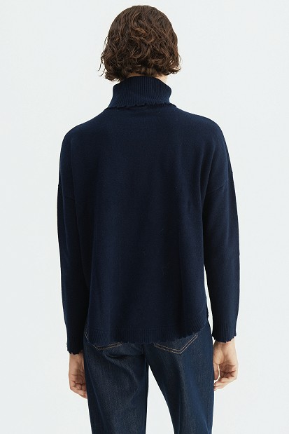 Wool turtleneck sweater with distressed details