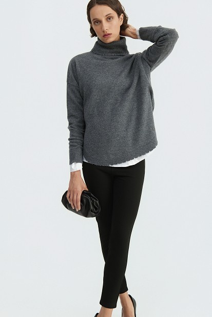 Wool turtleneck sweater with distressed details