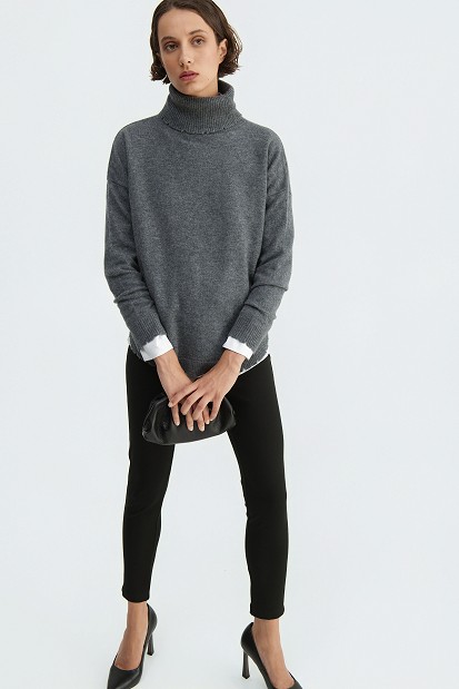 Wool turtleneck sweater with distressed details