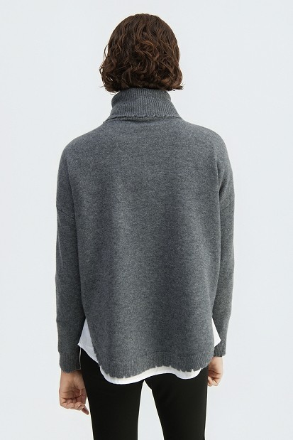 Wool turtleneck sweater with distressed details