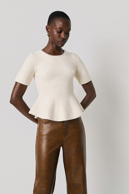 Pulover stil peplum cu decolteu cu pietricele