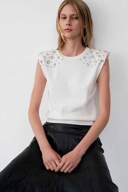 Sleeveless sweater with rhinestone embellishments