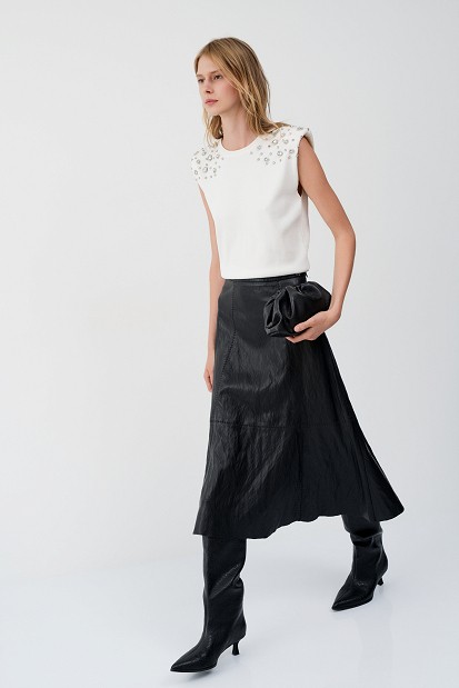 Sleeveless sweater with rhinestone embellishments