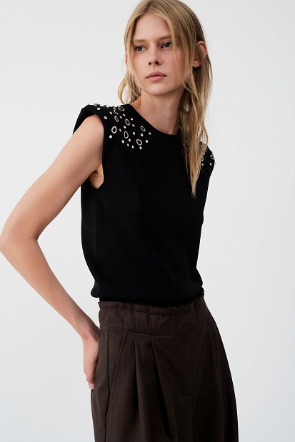 Sleeveless sweater with rhinestone embellishments