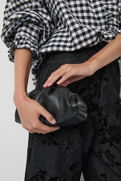 Leather clutch bag with a ruched design