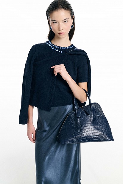 Handbag with asymmetric shape and croc-effect texture