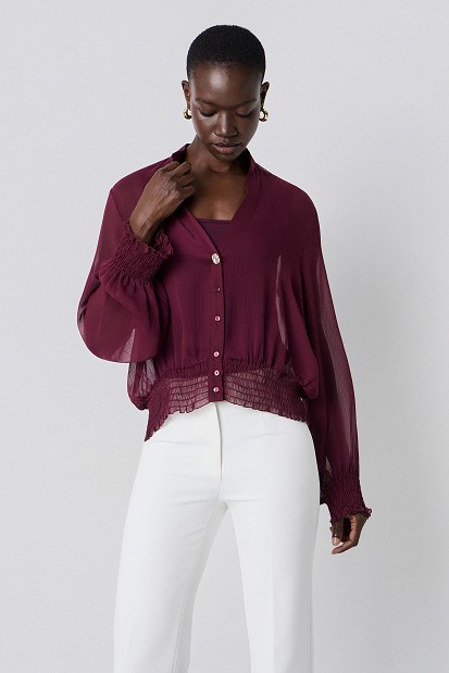 Semi-sheer top with smocked details