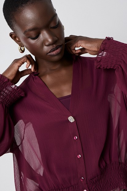 Semi-sheer top with smocked details