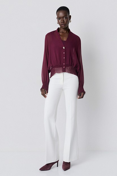 Semi-sheer top with smocked details