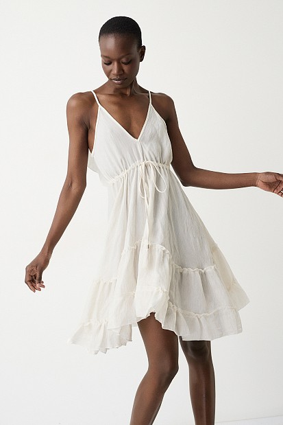 Mini dress with ruffles and open back
