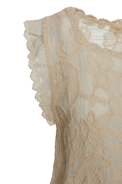 Sleeveless embroidered top with buttons