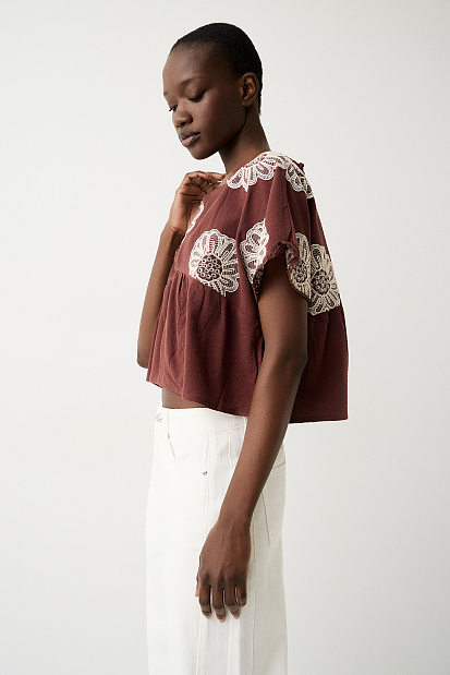 V top with embroidered details
