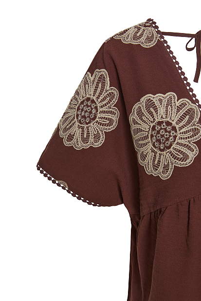 V top with embroidered details
