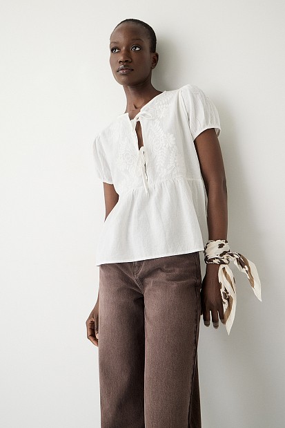 Embroidered blouse with short sleeves and self tie
