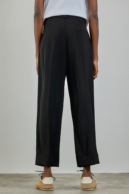 Trousers with turn-up hem