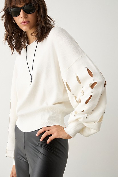 Sweater with cut outs on the sleeves