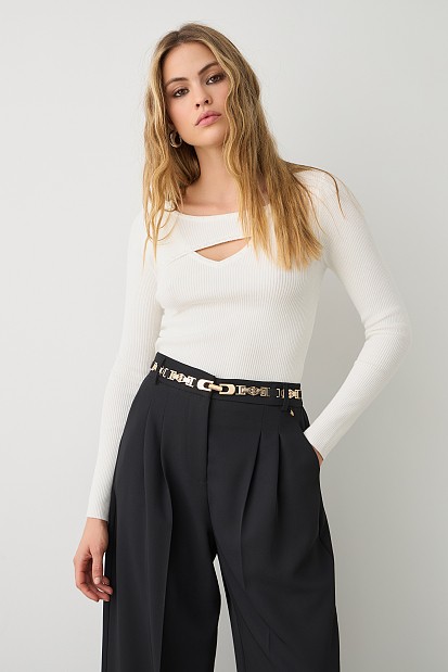 Sweater with rhinestones and cut out