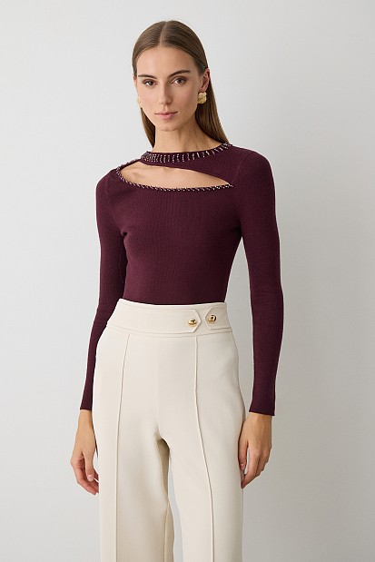 Cut out sweater with beads