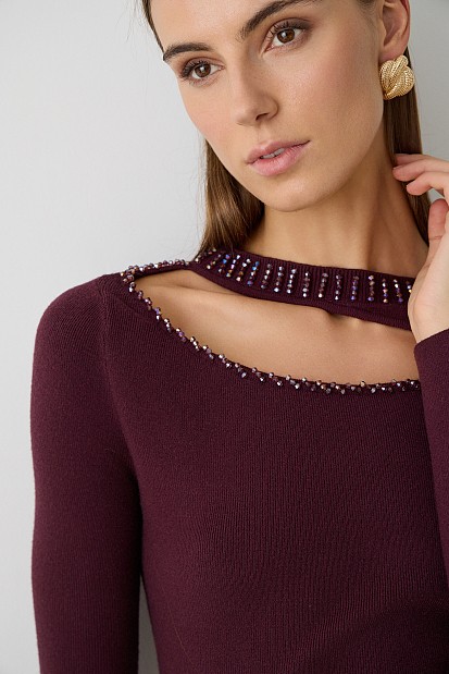 Cut out sweater with beads