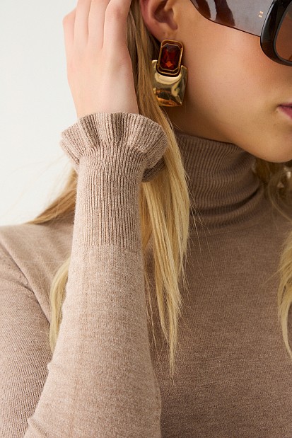 Turtleneck sweater with frills on the sleeves