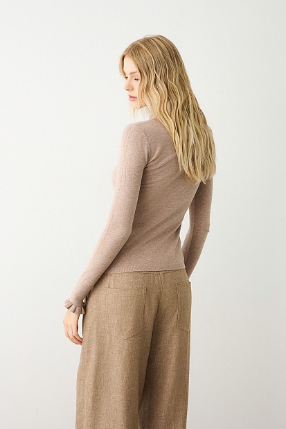 Turtleneck sweater with frills on the sleeves