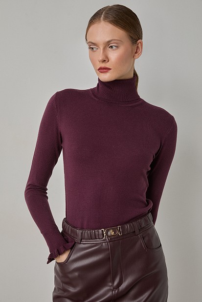 Turtleneck sweater with frills on the sleeves