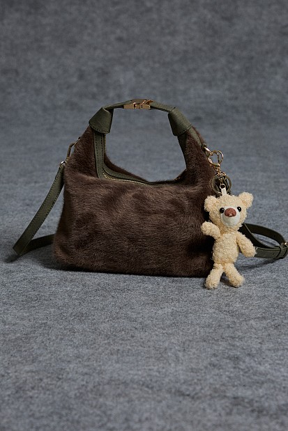 Furry bag with hanging accessory
