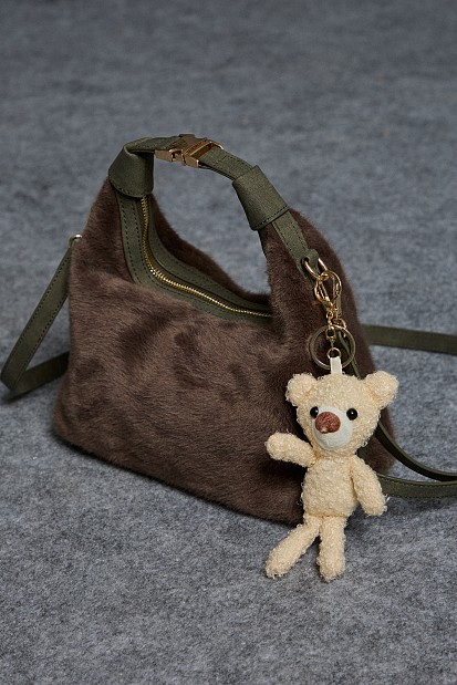 Furry bag with hanging accessory