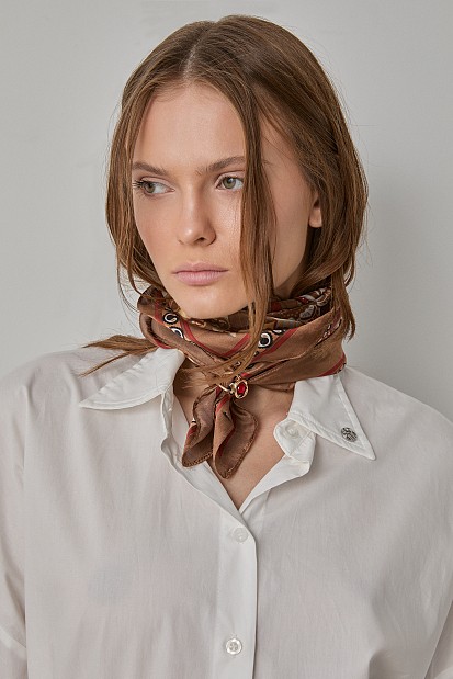 Printed scarf with jewelry