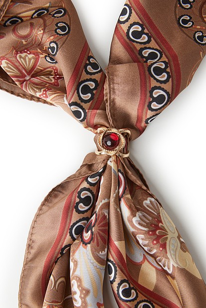 Printed scarf with jewelry