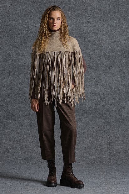 Knitted fringed cape