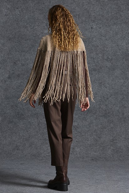 Knitted fringed cape