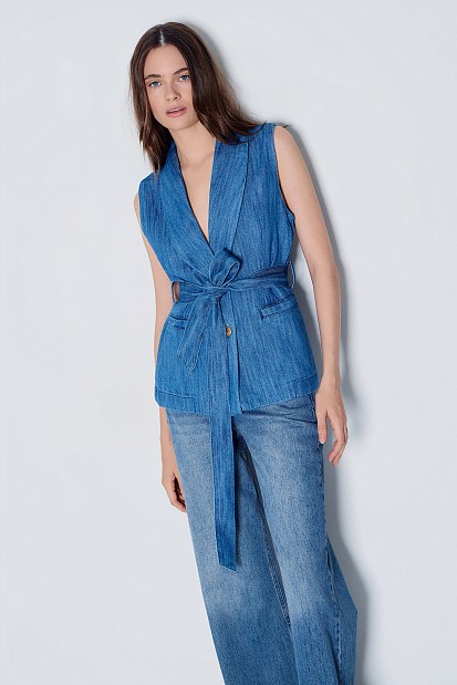 Long denim vest with a belt