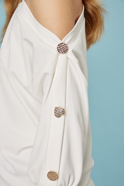 Off-shoulder blouse with bejeweled buttons
