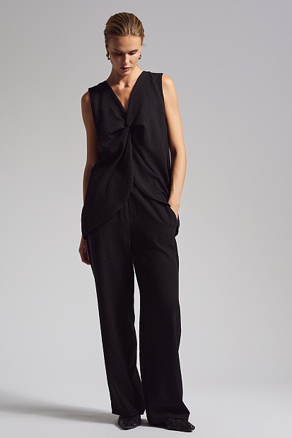 Sleeveless blouse with slit