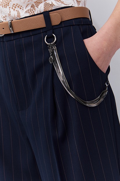 Striped trousers with belt and chain