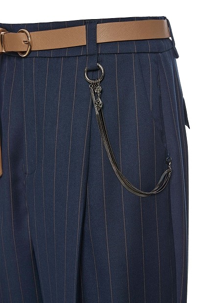 Striped trousers with belt and chain