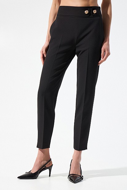 Trousers with bejeweled buttons