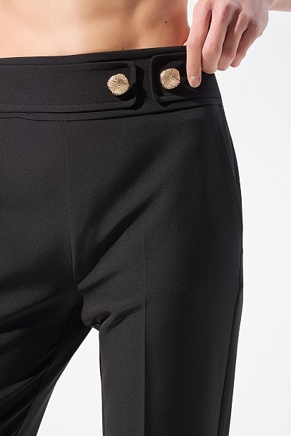 Trousers with bejeweled buttons