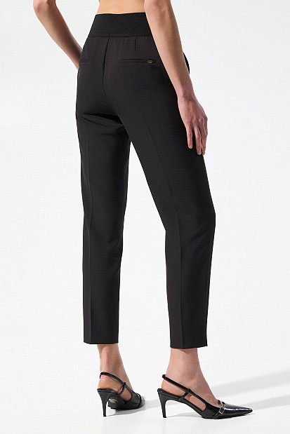 Trousers with bejeweled buttons