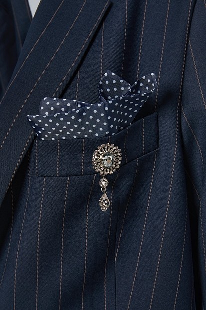 Striped blazer with bejeweled pin