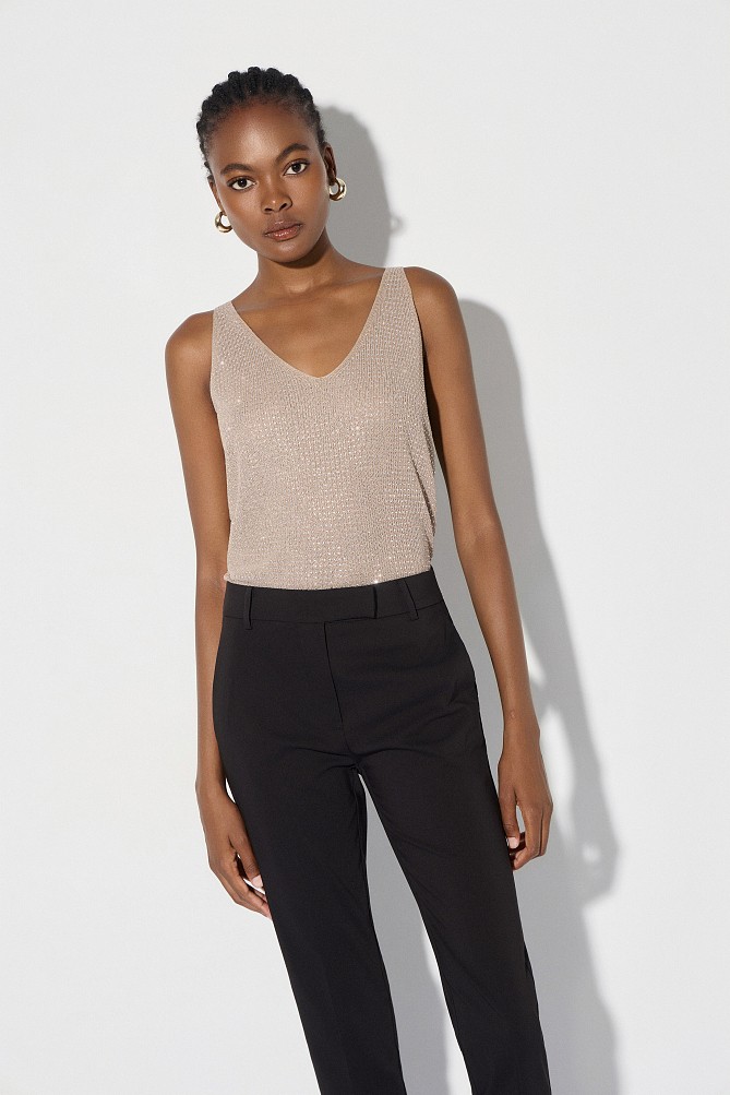 Sleeveless knitted lurex top with rhinestone embellishments