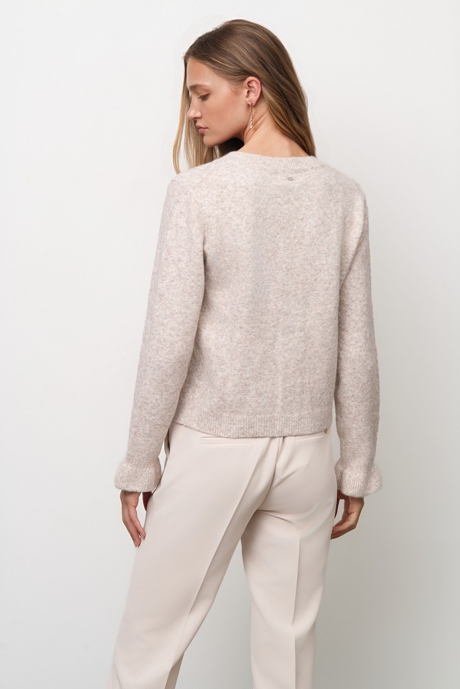 Knitted cardigan with jewel buttons and ruffles