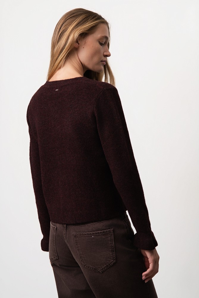 Knitted cardigan with jewel buttons and ruffles