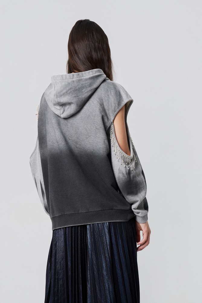 Hoodie with cut-out details and decorative embellishments