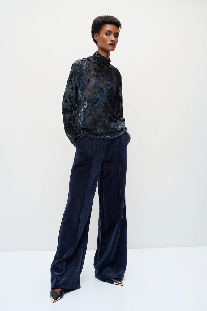 Sheer top with raised floral details
