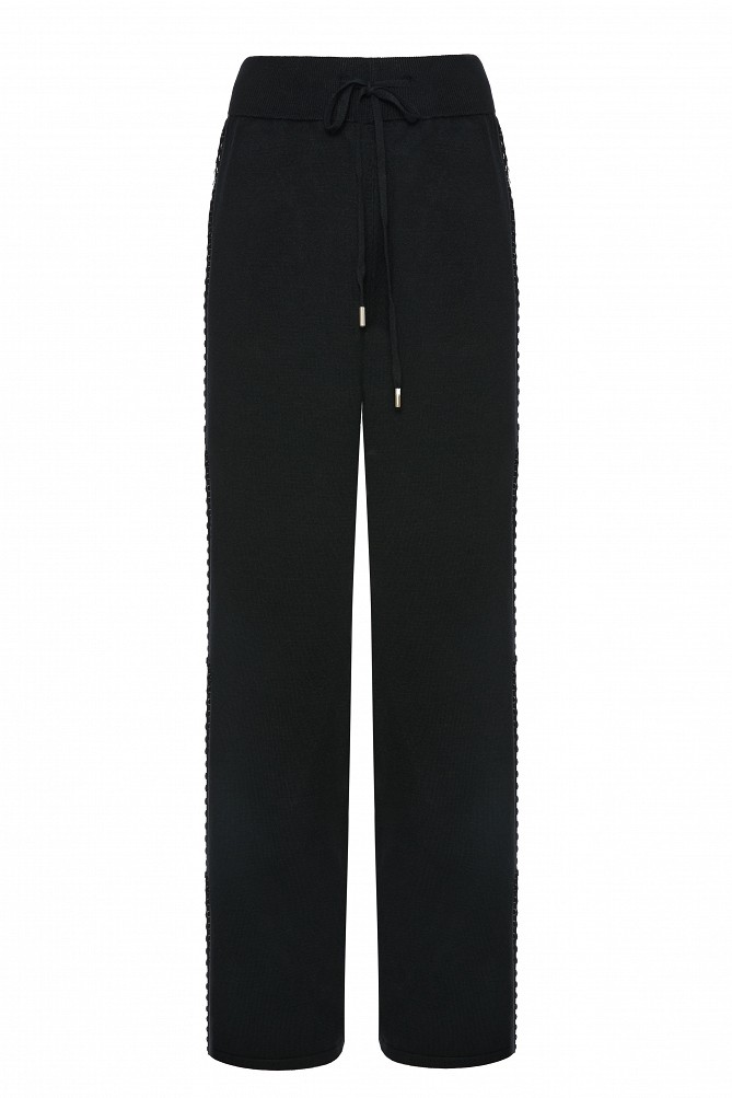 Knitted trousers with side snap buttons